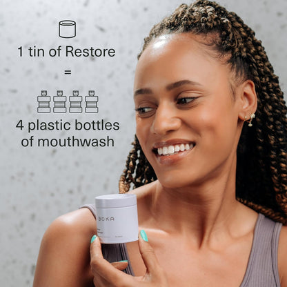 Smiling woman with Restore Mouthwash Tablets; text touts probiotics to remineralize teeth vs. bottled rinse.