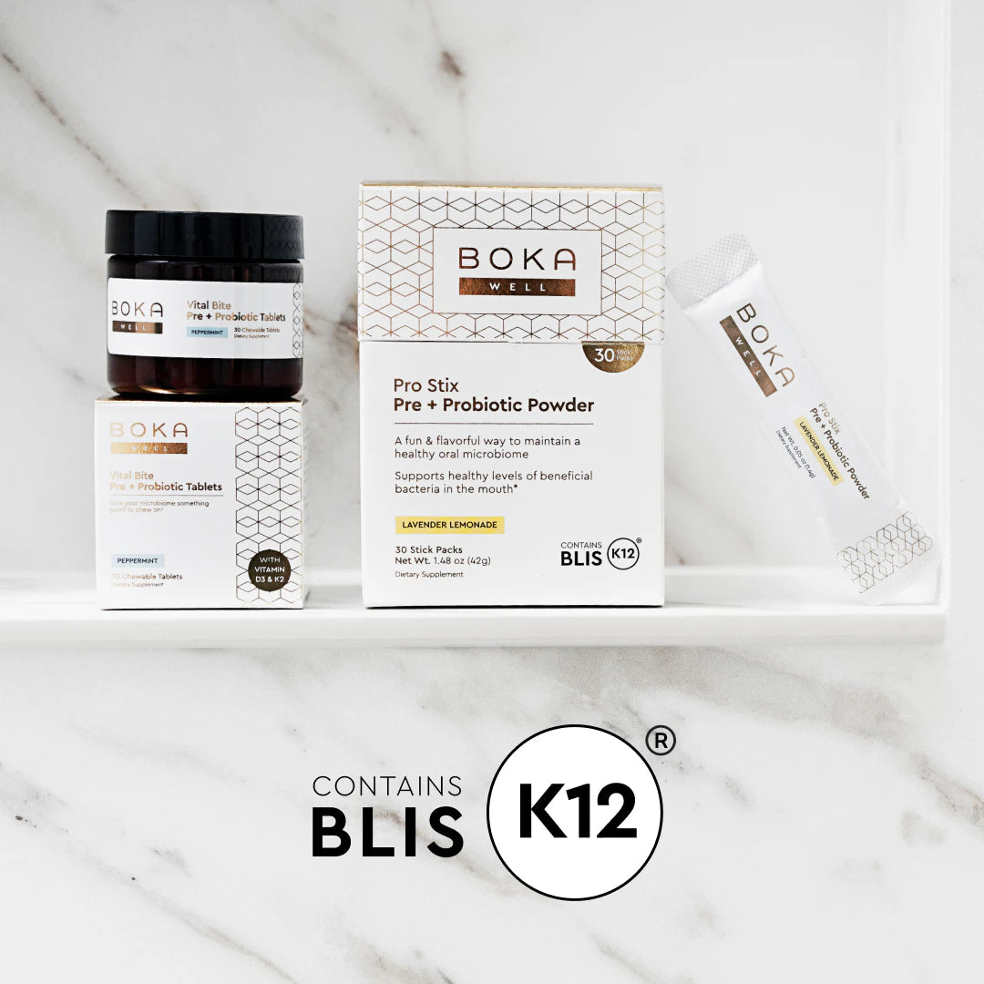 BOKA probiotic products on a white shelf, including tablets, powder box, and a single powder stick.