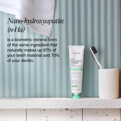 Ela Mint n-Ha Toothpaste in a cup, highlighting nano-hydroxyapatite oral care benefits.