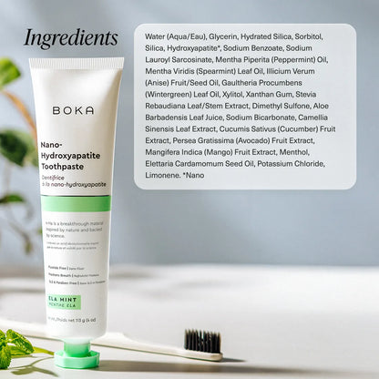 A tube of Ela Mint n-Ha Toothpaste stands by a toothbrush, elevating your oral care routine.