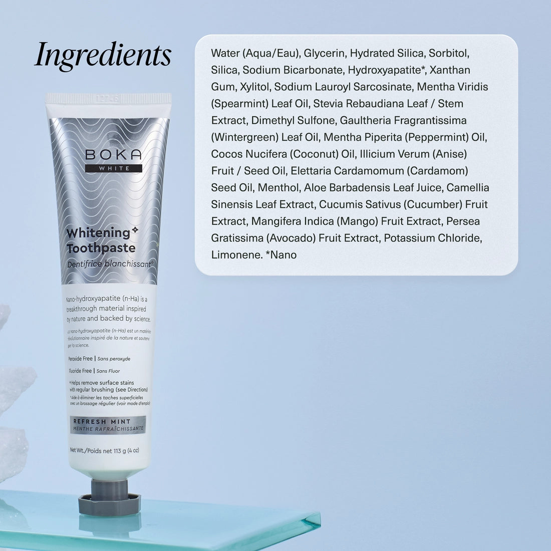 A tube of Refresh Mint Whitening* n-Ha Toothpaste stands upright by its ingredient list on a light blue background.