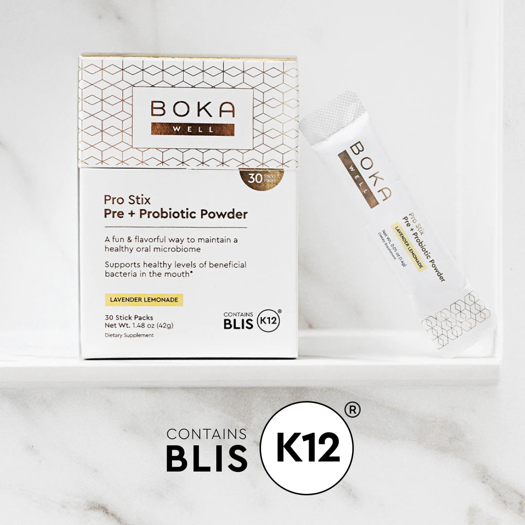 Boka Pro Stix Pre + Probiotic Powder box and single stick on a white surface, labeled “Contains BLIS K12.”.