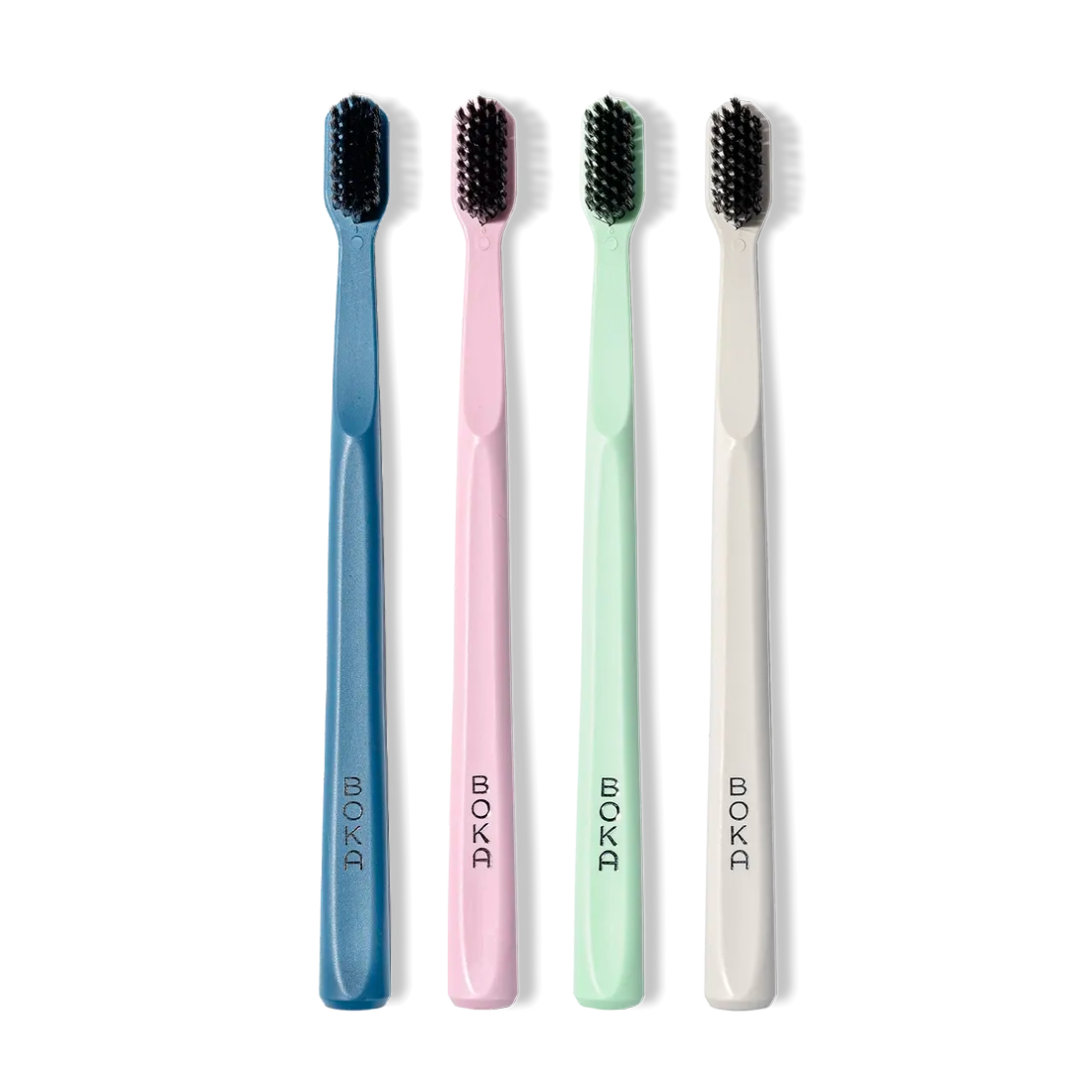 The Classic Toothbrush 4-Pack features soft bristles in blue, pink, green, and white upright brushes.