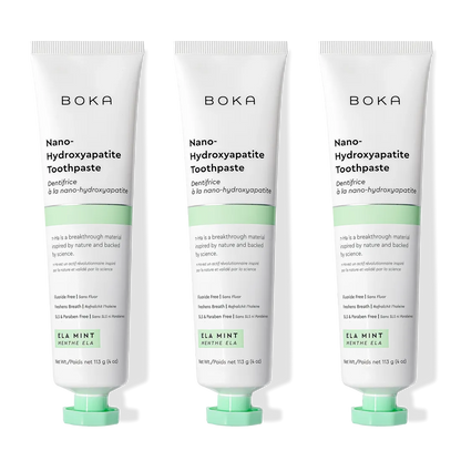 Three tubes of Ela Mint n-Ha Toothpaste stand upright, ideal for daily oral care routines.