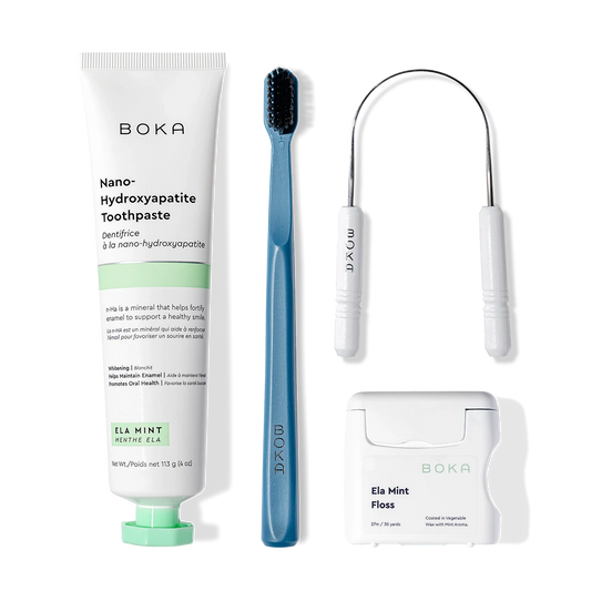 Starter Kit: toothpaste, blue toothbrush with charcoal bristles, tongue cleaner, and floss.