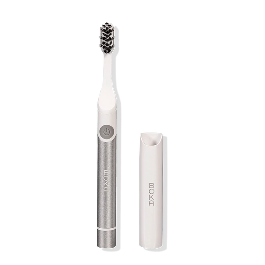 Boka Pocket Electric Toothbrush in silver with Sonic Pulse, white brush head, and travel cap.