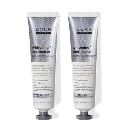 Two tubes of Refresh Mint Whitening* n-Ha Toothpaste, peroxide-free, stand side by side.