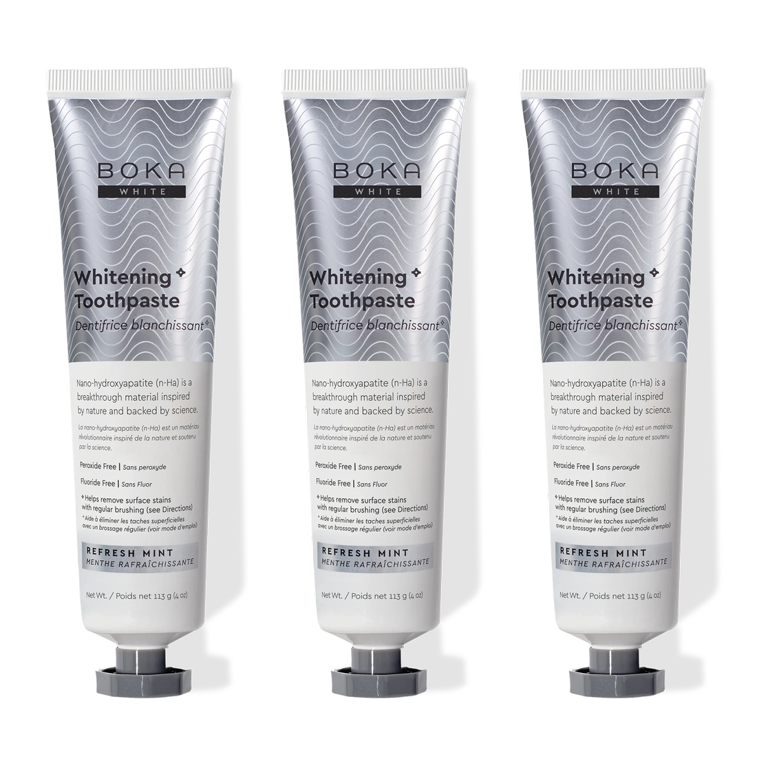 Three tubes of Refresh Mint Whitening* n-Ha Toothpaste, peroxide-free, standing upright side by side.