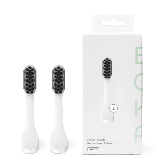 Two white Replacement Heads for Boka Pocket Brush beside their labeled box.