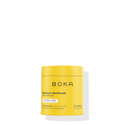 A yellow container of Restore Mouthwash Tablets - Citrus Mint is shown on a white background.