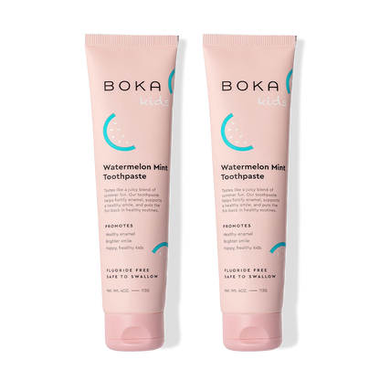 Two tubes of Watermelon Mint n-Ha Toothpaste for kids, standing upright.